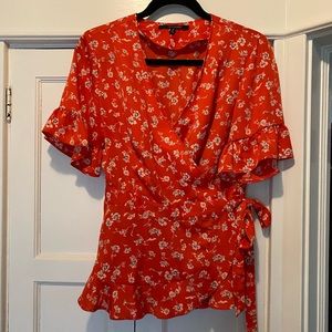 Like new!! Cute red wrap top! Perfect for fall